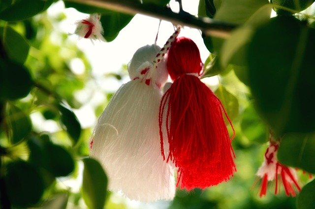 Baba Marta Day celebration with red and white Martenitsa symbolizing spring and renewal